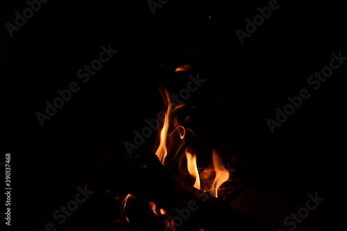 Warm fire and sparks in a fire-place from conflagrant wooden logs