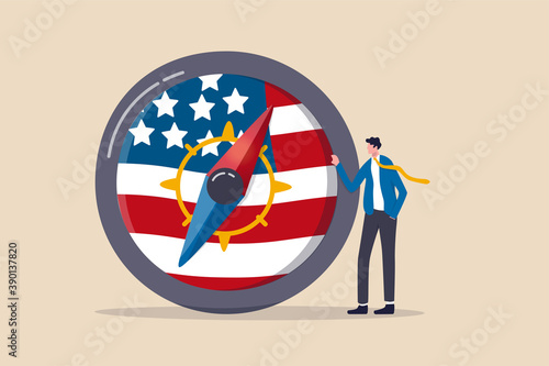 World and United States economic direction after presidential election, direction of US Federal Reserve, FED in financial crisis concept, businessman leader stand with compass with USA national flag.