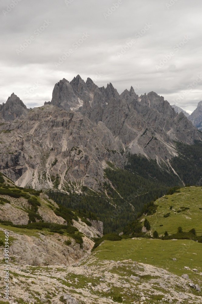 Obraz premium Hiking and climbing at the stunning Passo Giau in the Dolomite mountains of Northern Italy
