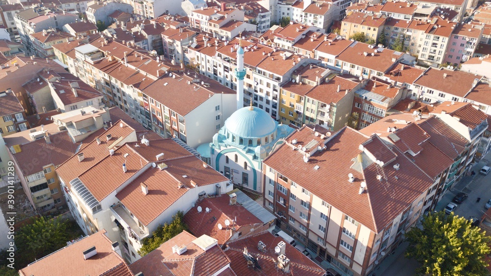 aerial view of city ​​mosque between the buildings