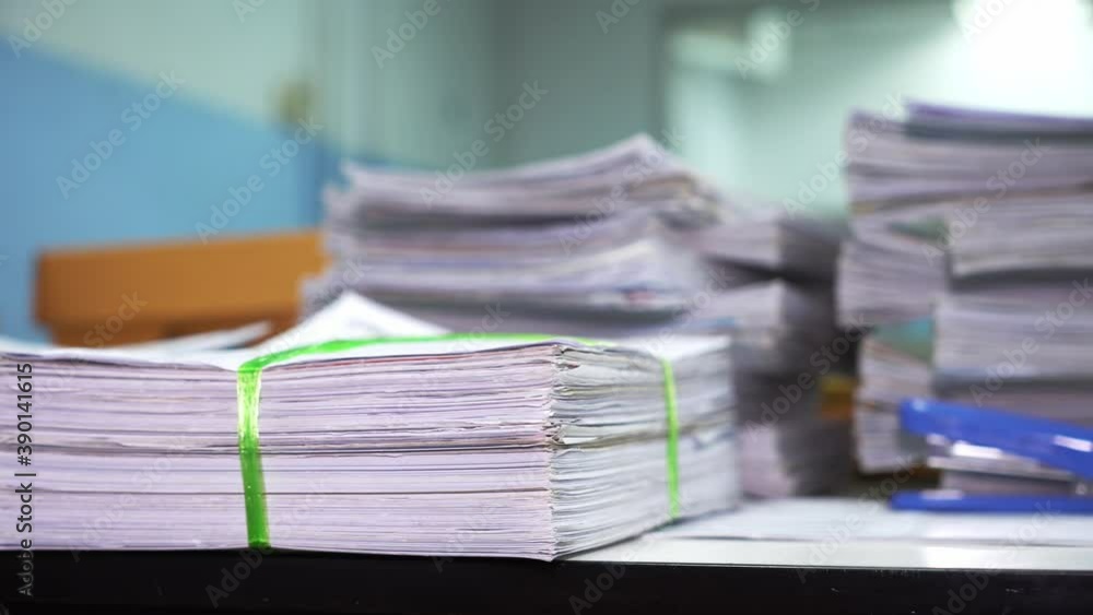 Stack of documents on desktop in office. Stack of documents on desktop in office.
