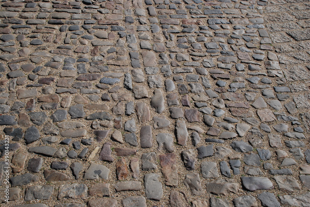 Symmetry of the stone. Cobblestone paving stone sand harmony of centuries