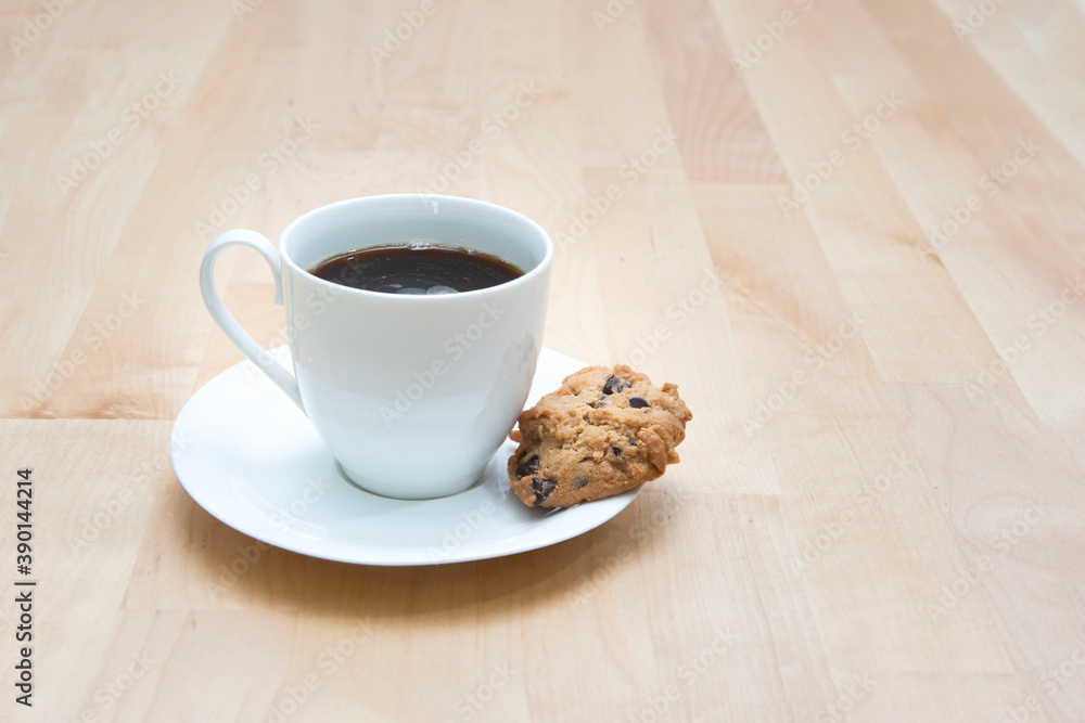 Cup of coffee with chocolate cookie on wooden background Cup of coffee with chocolate cookie on wooden background
