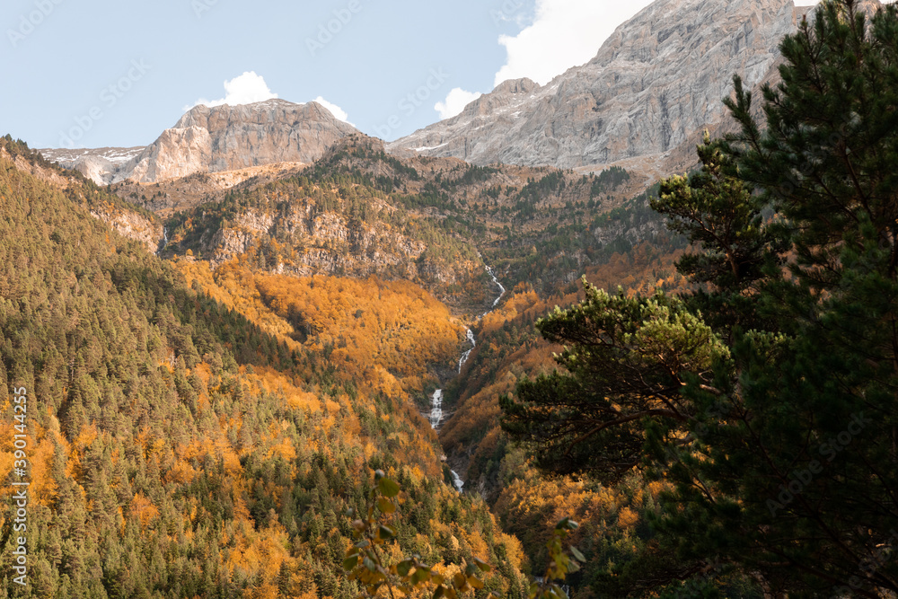 Beautiful landscape of a waterfall in the mountains in autumn Beautiful landscape of a waterfall in the mountains in autumn