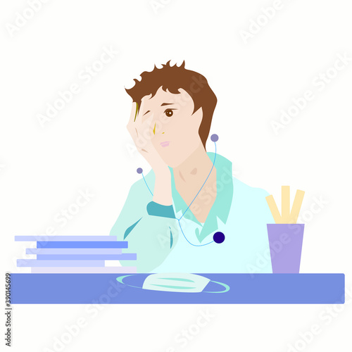 A tired doctor sits at a table with documents