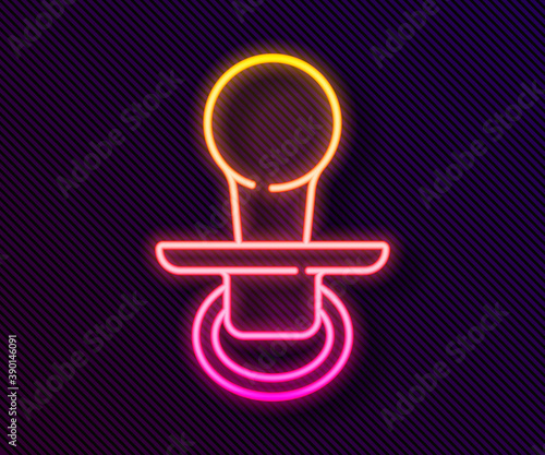 Glowing neon line Baby dummy pacifier icon isolated on black background. Toy of a child. Vector.