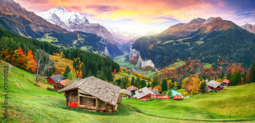 Scenic autumn view of picturesque alpine Wengen village and Lauterbrunnen Valley photo