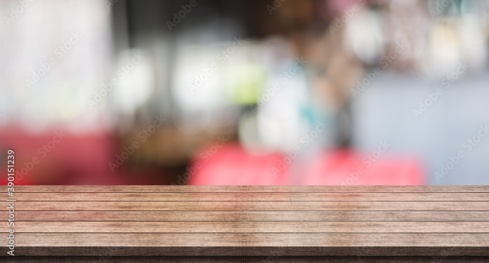 Empty wooden table top with lights bokeh on blur restaurant background Empty wooden table top with lights bokeh on blur restaurant background