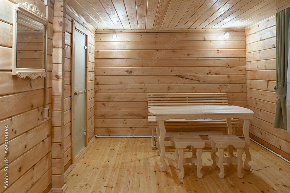Wooden table and chairs in a Russian bath in Altai Wooden table and chairs in a Russian bath in Altai