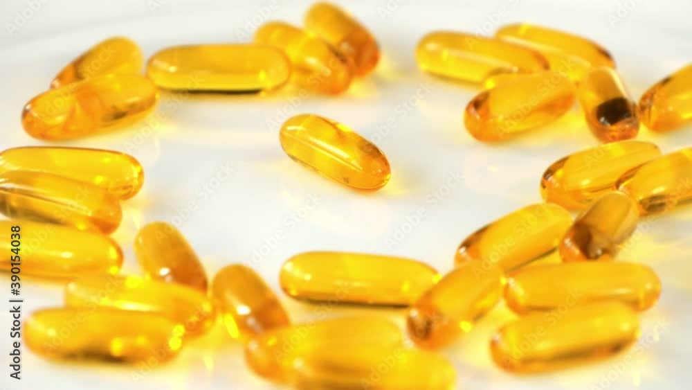 Omega-3 Capsules Rotating Background. Medical and Healthcare Concept. Vitamin E from Fish Oil. Pharmacy Utility Visualization. Healthy Nutrition in the Modern World Omega-3 Capsules Rotating Background. Medical and Healthcare Concept. Vitamin E from Fish Oil. Pharmacy Utility Visualization. Healthy Nutrition in the Modern World