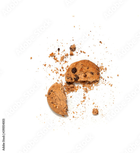 One broken Chocolate chip cookie isolated on white background. Sweet biscuit crumbs. Homemade pastry