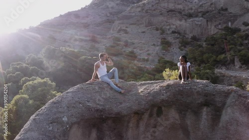 Tourists Relaxing In Rocky Landscape