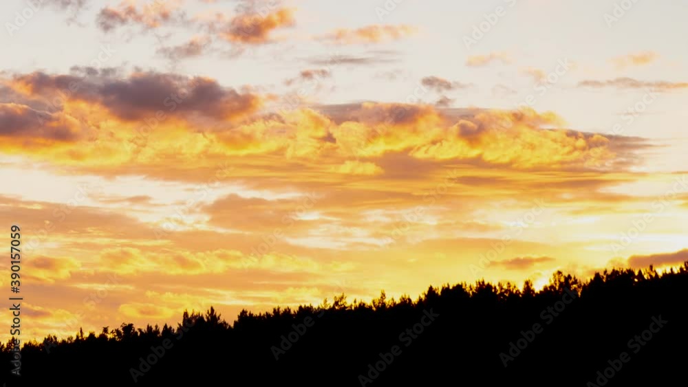 Sunset sky with orange clouds over the forest. Two planes fly by fast. Sunset sky with orange clouds over the forest. Two planes fly by fast.