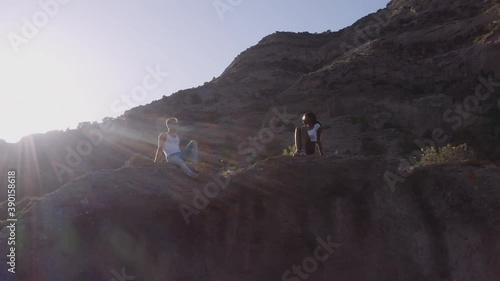 Tourist Couple In Rocky Landscape Under Sun