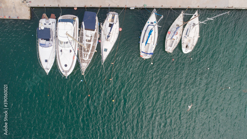 Aerial top down picture of yachts anchored in port. © dechevm