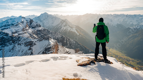 Canvastavla Hiker looking at view on mountain top summit on hiking travel vacation