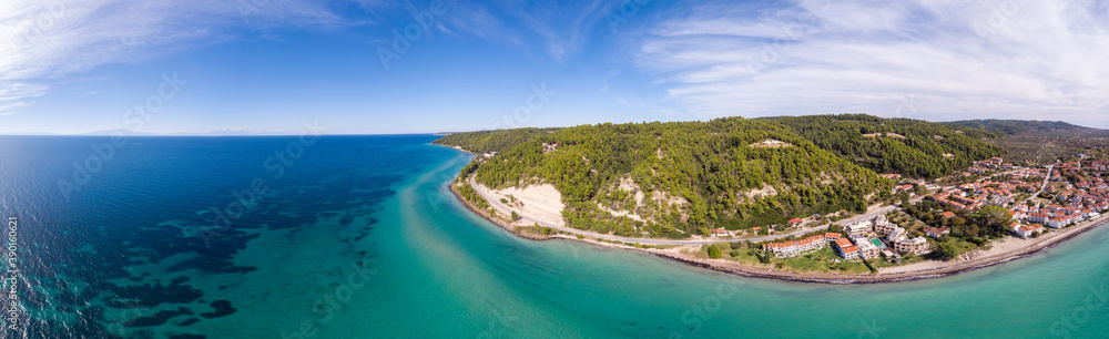 Aerial drone view of Fourka Skala sea and pine forest in Halkidiki, Greece