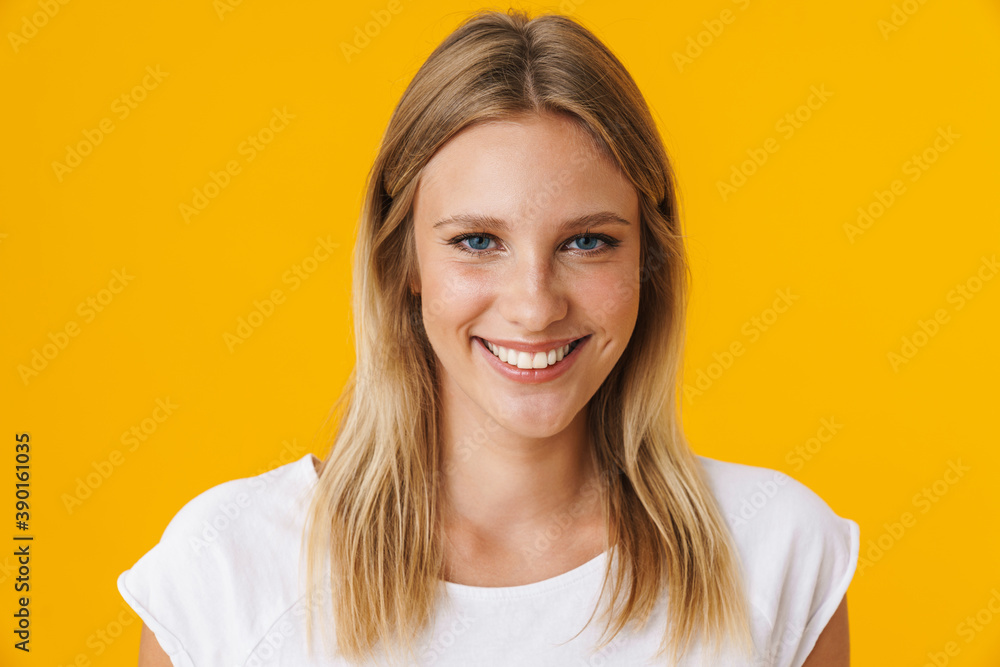 Cheerful beautiful girl smiling and looking at camera Cheerful beautiful girl smiling and looking at camera