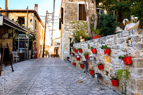 Fototapeta Naklejka Na Ścianę i Meble -  Street with flowers in Afitos, Halkidiki, Greece