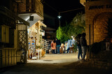 Street at night with people in Afitos, Halkidiki, Greece