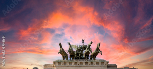 Obraz na płótnie Pink dramatic skies during sunset over the bronze horses at corte di cassazione supreme court in Rome, italy