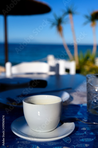 White coffee cup on a breakfast table in Greece