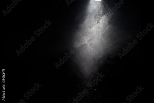 single light with trapped in smoke and debris
