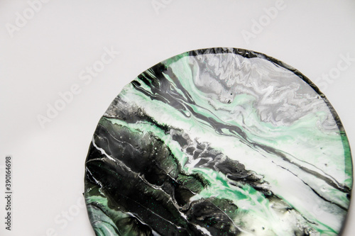 Planet colorful waves in resin art technique