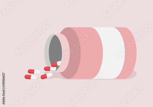 Bote de antibiótico con pastillas rojas y blancas.