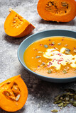 Pumpkin cream soup in the bowl. Close-up