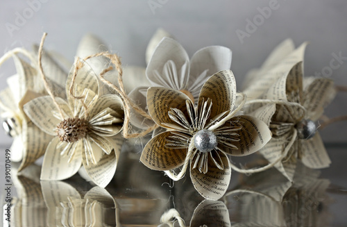Decorative paper flowers hand made of book pages 