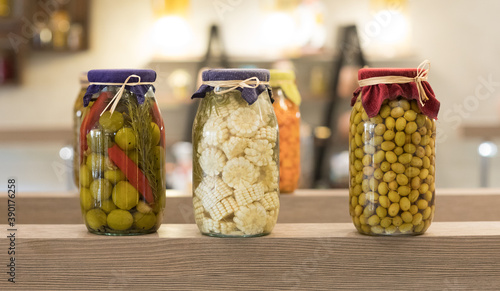 canned vegetables and fruits in glass jars