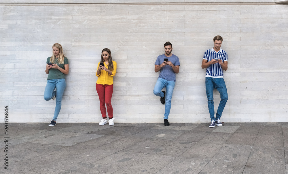 Young people with smartphone standing in a line with social distance