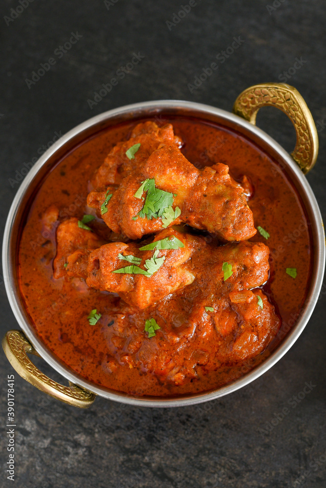 Spicy red chicken curry. Goan style chicken vindaloo. Butter chicken Murgh Makhani curry roast hot and spicy gravy dish Dhaba Punjab, India. North Indian non-vegetarian cuisine Garam Masala. tikka Spicy red chicken curry. Goan style chicken vindaloo. Butter chicken Murgh Makhani curry roast hot and spicy gravy dish Dhaba Punjab, India. North Indian non-vegetarian cuisine Garam Masala. tikka