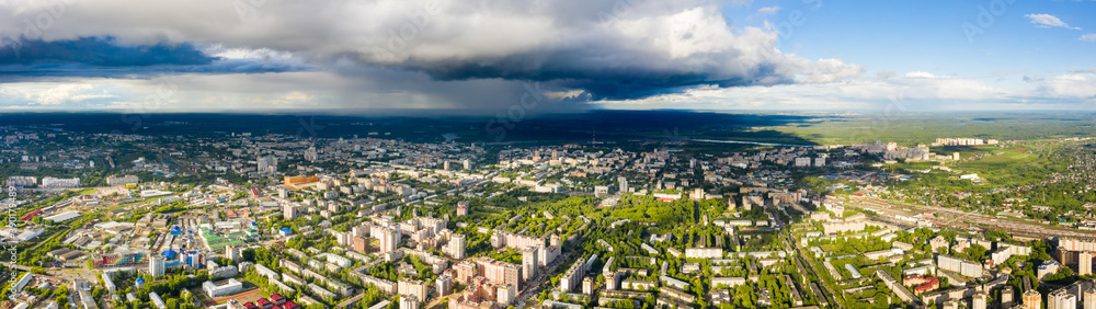 Panorama of the Kirov city and pioneer palace in Leninsky district in the central part of the city of Kirov on a summer day against the backdrop of thunderstorms and storms.