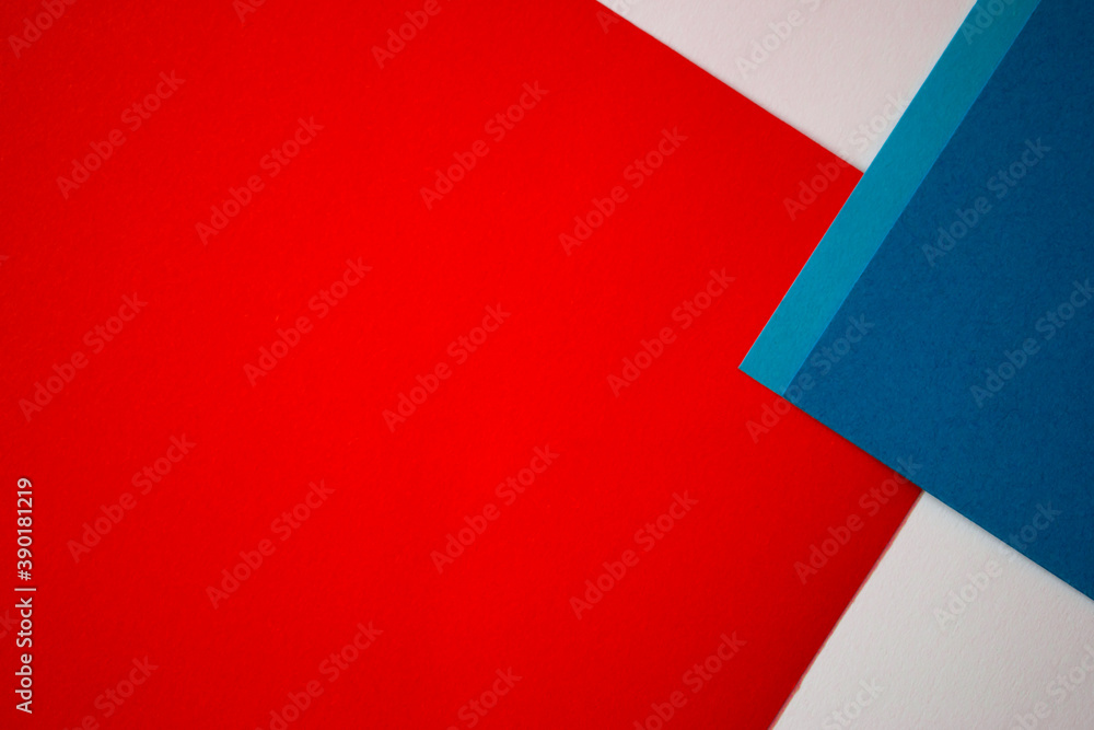 Red, blue and white geometric colored paper background Red, blue and white geometric colored paper background