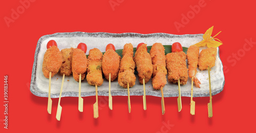 Mixed meat dishes deep fried skewers photo