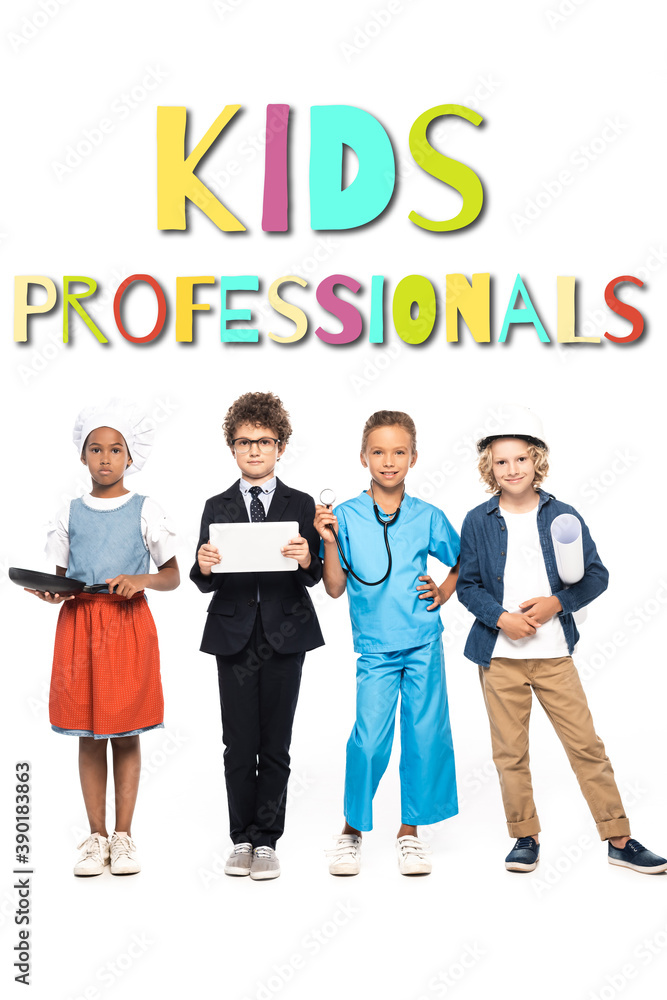 Obraz premium multicultural children in costumes of different professions near kids professionals lettering on white