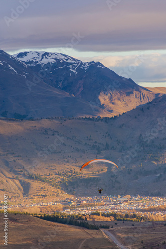 Low angle view of paraglider against sky with clouds in Esquel, Patagonia, Argentina