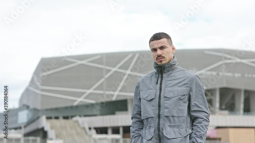 Wallpaper Mural Stylish Young Man With Pierced Ears On The Street. Serious Facial Expression. Torontodigital.ca