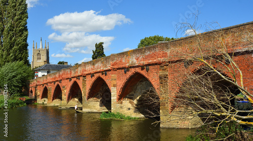 Great Barford Packhorse Bridge and Church Bedfordshire England.