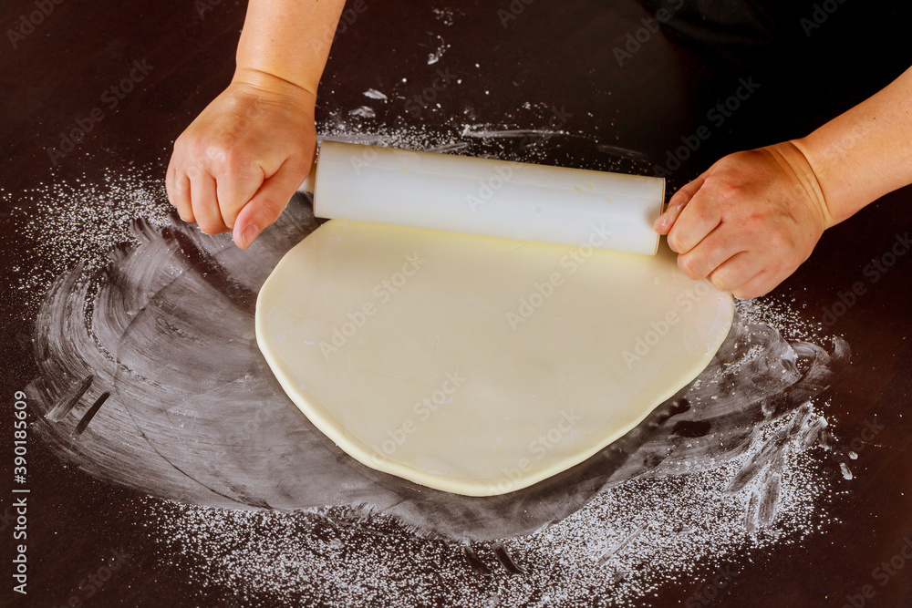Baker making of fondant cake in kitchen. Baker making of fondant cake in kitchen.