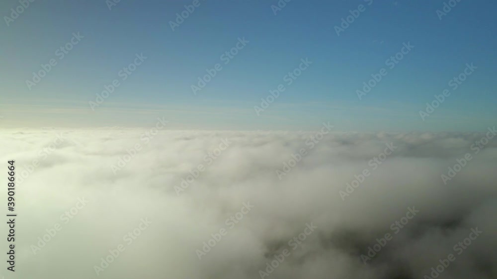 Above the clouds. Flight through the clouds in the morning. Fog, sky, thick clouds.
Above the clouds. Flight through the clouds in the morning. Fog, sky, thick clouds.