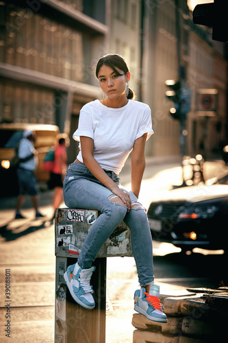 Portrait of woman sitting on pedestal