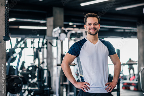 Portrait of a handsome athlete in the gym.