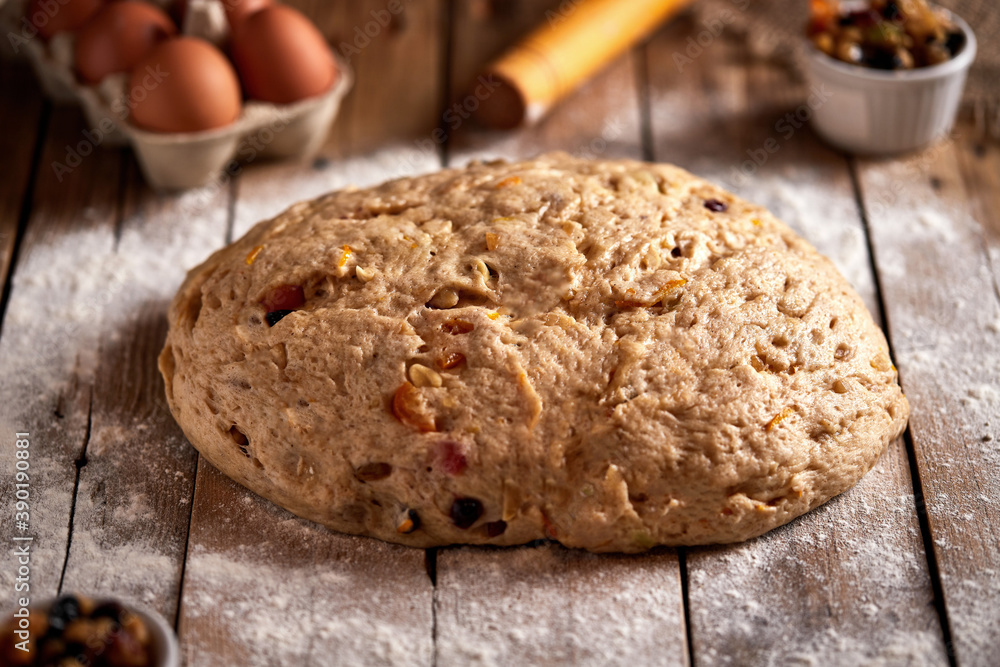 Fototapeta premium Stollen dough, traditional German Christmas stuffed with raisins and candied fruit