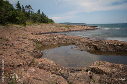 View of Lake Superior from the shoreline in Two Harbors, Minnesota with tide pool in foreground.