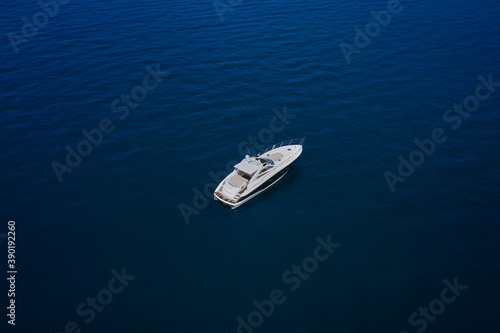 Top view of the boat. Yacht on blue water. © Berg
