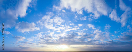 Panorama of bright evening and morning sky  shining sun.