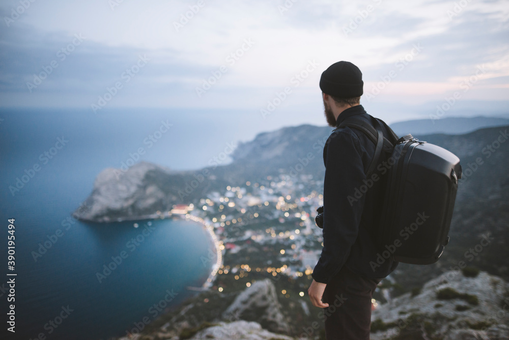 Italy, Liguria, La Spezia, Man looking at mountain range from mountain top Italy, Liguria, La Spezia, Man looking at mountain range from mountain top